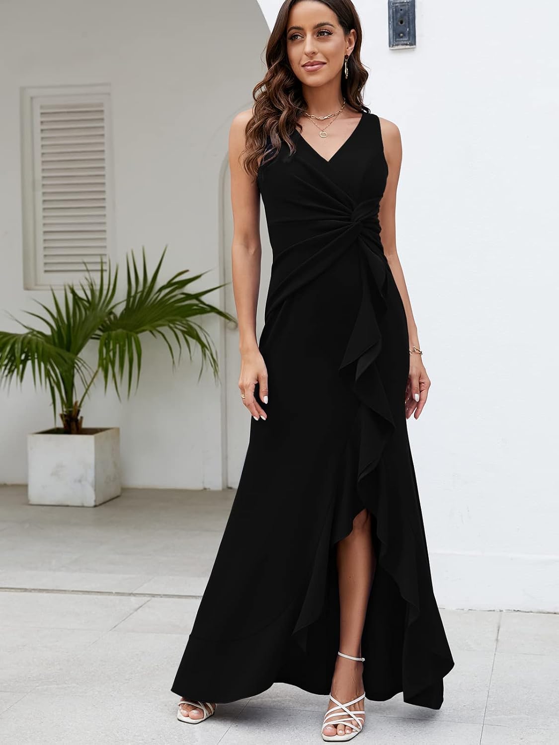 High-quality black formal dress with soft, stretchy material, flattering V-neck, sleeveless, and floor-length hem for evening parties.