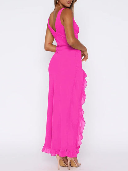 Sleeveless, backless maxi dress with sexy v-neck, high slit, and mesh ruffle hem for chic, romantic look.