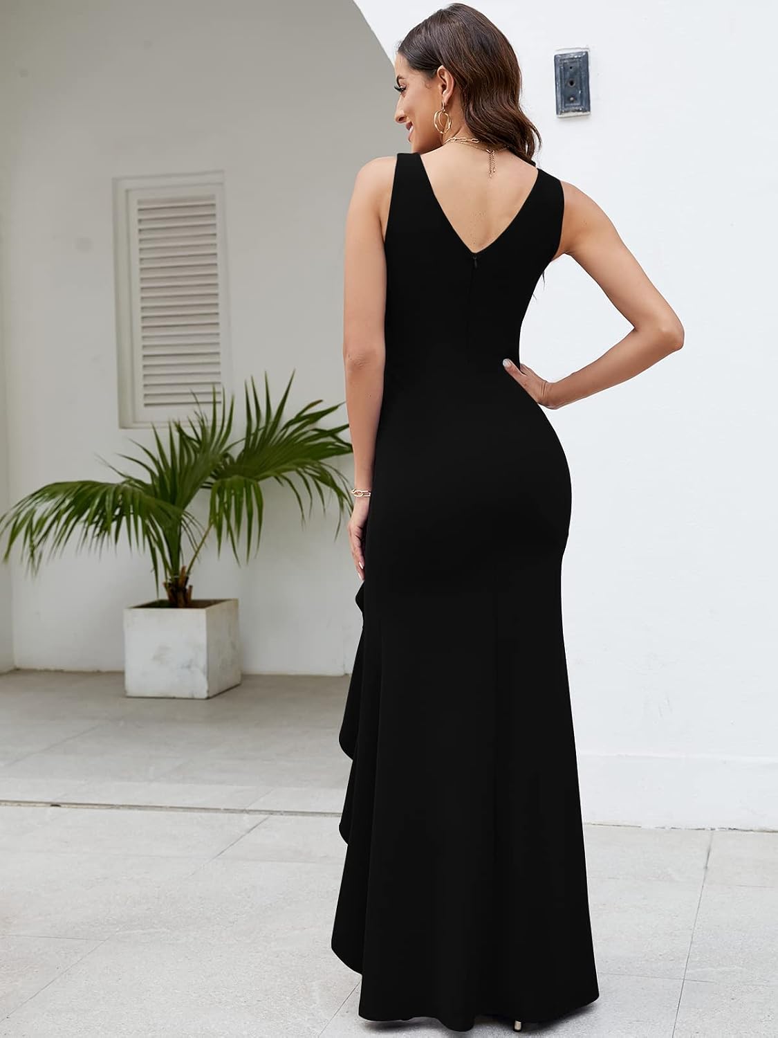 High-quality black formal dress with soft, stretchy material, flattering V-neck, sleeveless, and floor-length hem for evening parties.