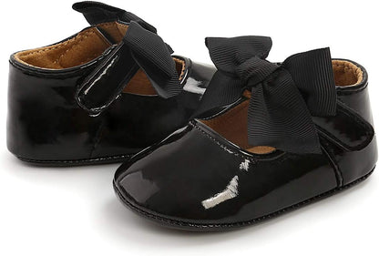 These adorable baby girl shoes are super soft and comfortable, with an adjustable closure to stay on little feet. Perfect for any occasion.