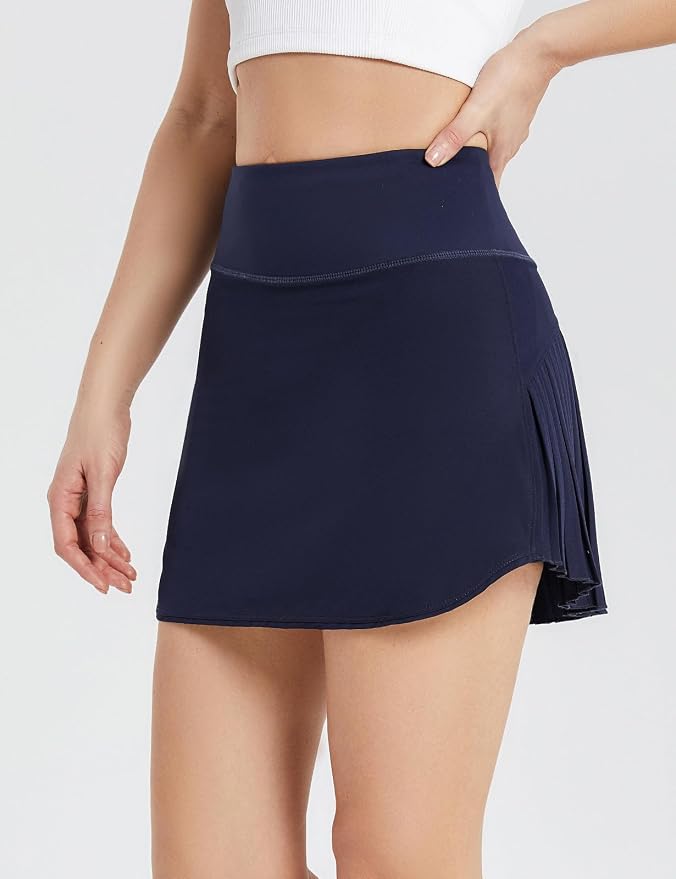 Baleaf pleated tennis skirt, high-waisted, tummy control, multiple pockets, fashionable and practical for active lifestyle.
