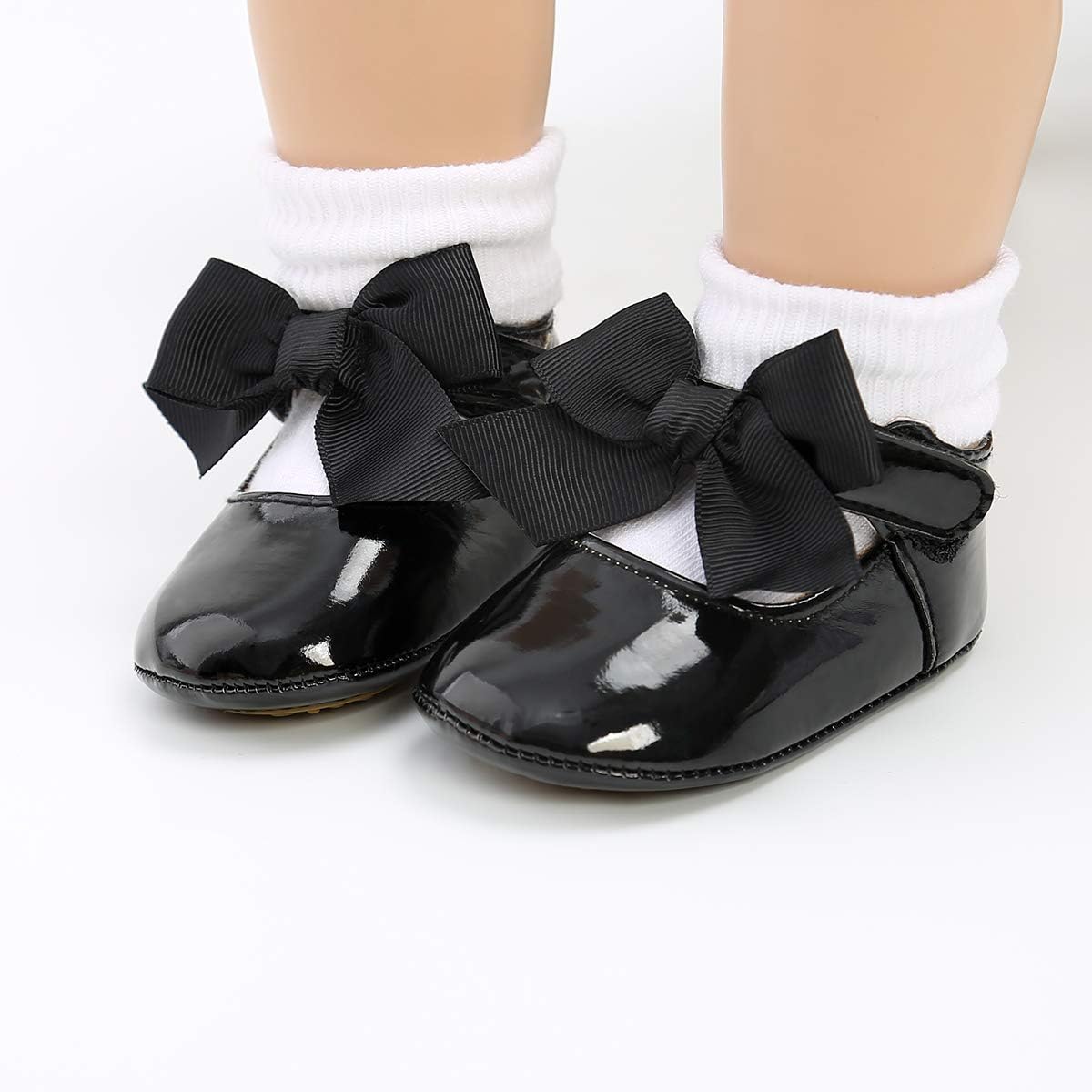 These adorable baby girl shoes are super soft and comfortable, with an adjustable closure to stay on little feet. Perfect for any occasion.