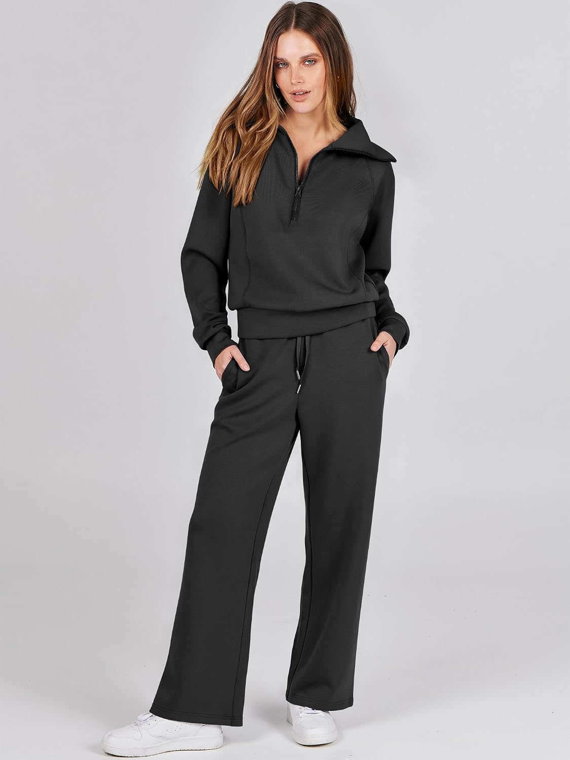 This cozy 2-piece sweatsuit set features an oversized sweatshirt and wide-leg sweatpants for a comfortable, stylish look.