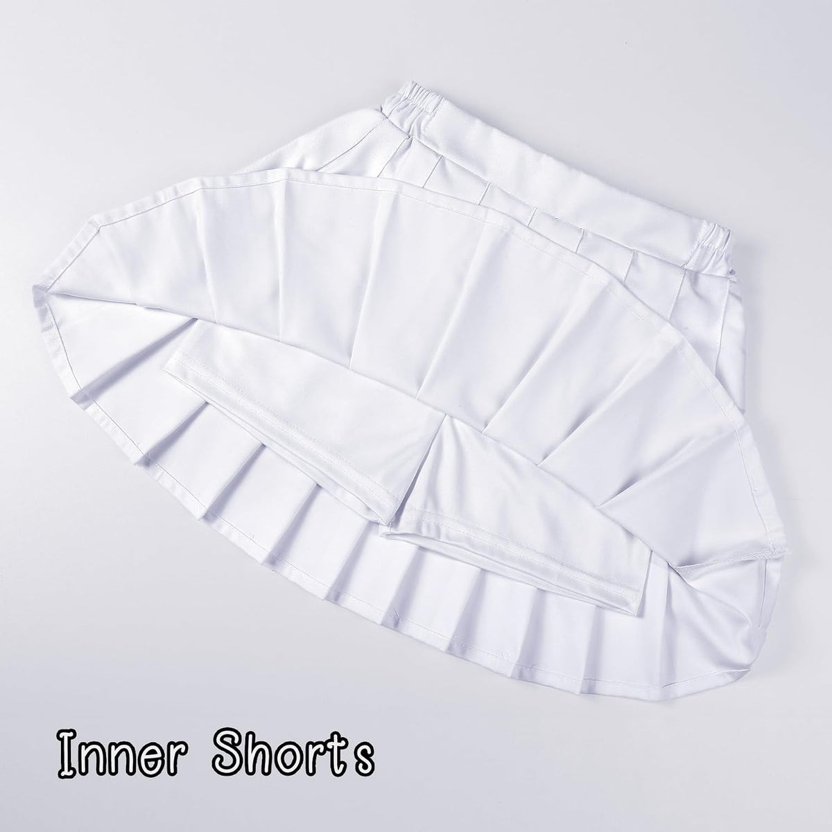 High-quality pleated mini skirt, perfect for school, parties, or everyday wear, with breathable polyester fabric and attached safety shorts.