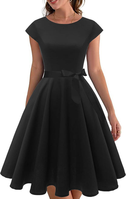 1950s-inspired cocktail dress, flattering boatneck, cap sleeves, pockets, stylish and practical. Check it out on - you won't regret it!
