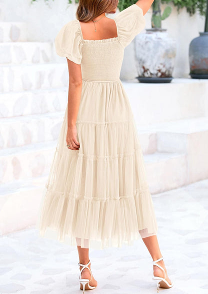 Flattering square neckline, puffed sleeves, smocked bodice, lightweight tulle fabric, beautiful feminine look, cool and comfortable.