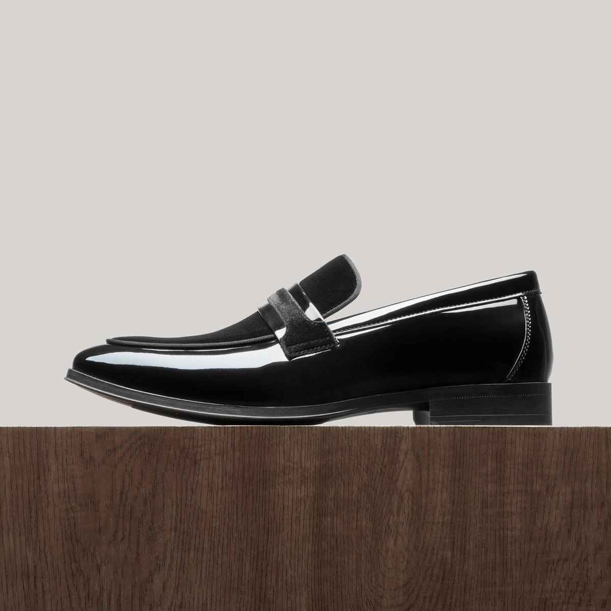 Stylish and comfortable patent leather and velvet loafers from Bruno Marc, with a slip-on design.
