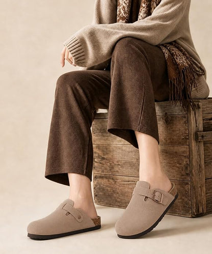 These genuine suede clogs from ODOLY feature a soft cork footbed, arch support, and an adjustable buckle for all-day comfort and a fashionable look.