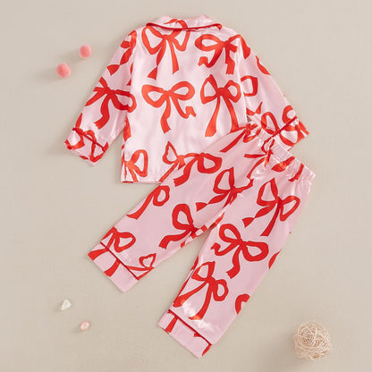 High-quality satin pajama set with Santa Claus and holiday print, soft, breathable fabric, and comfortable fit for cozy winter nights.