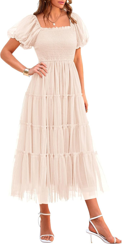 Flattering square neckline, puffed sleeves, smocked bodice, lightweight tulle fabric, beautiful feminine look, cool and comfortable.