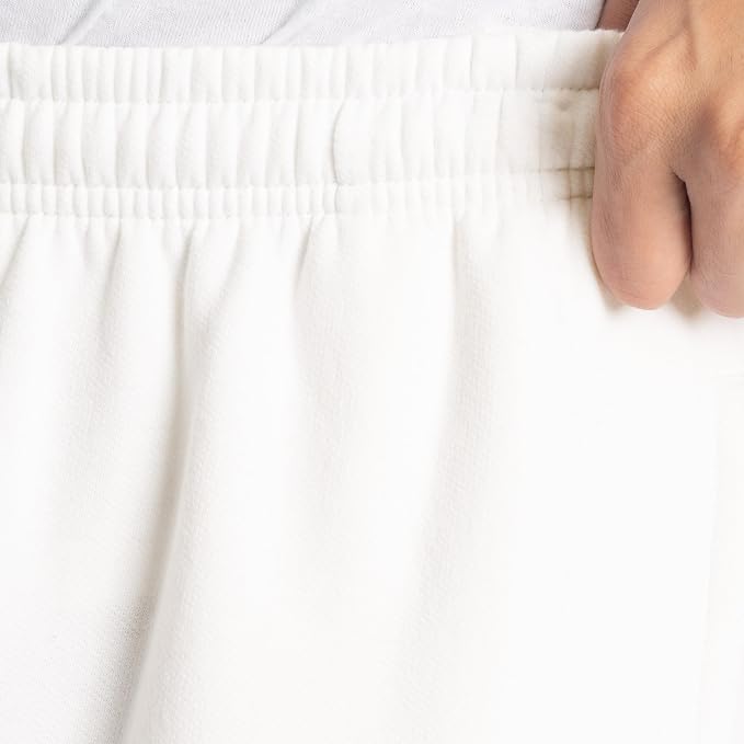 Moisture-wicking sweatpants with adjustable waistband and pockets, ideal for lounging, workouts, and everyday use.