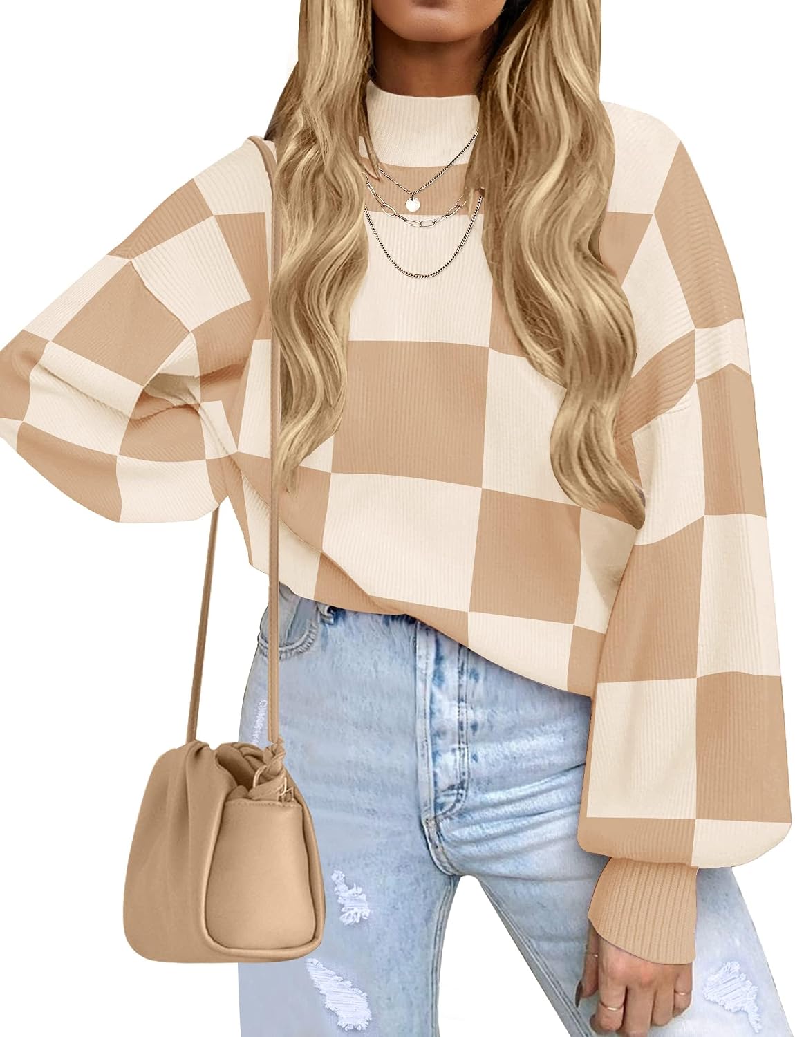 Soft, ribbed knit sweater with chic turtleneck, striped or plaid pattern, and loose, flattering fit for layering. It's a popular product!