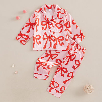 High-quality satin pajama set with Santa Claus and holiday print, soft, breathable fabric, and comfortable fit for cozy winter nights.