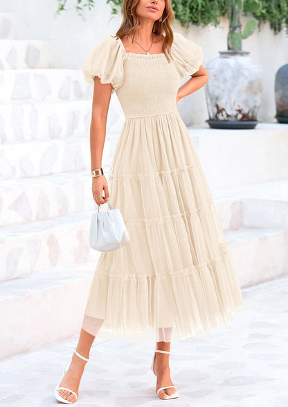 Flattering square neckline, puffed sleeves, smocked bodice, lightweight tulle fabric, beautiful feminine look, cool and comfortable.