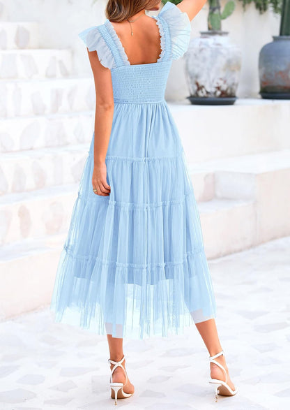 Sleeveless midi dress with tulle fabric, smocked design, flattering fit, suitable for parties, weddings, and summer occasions.