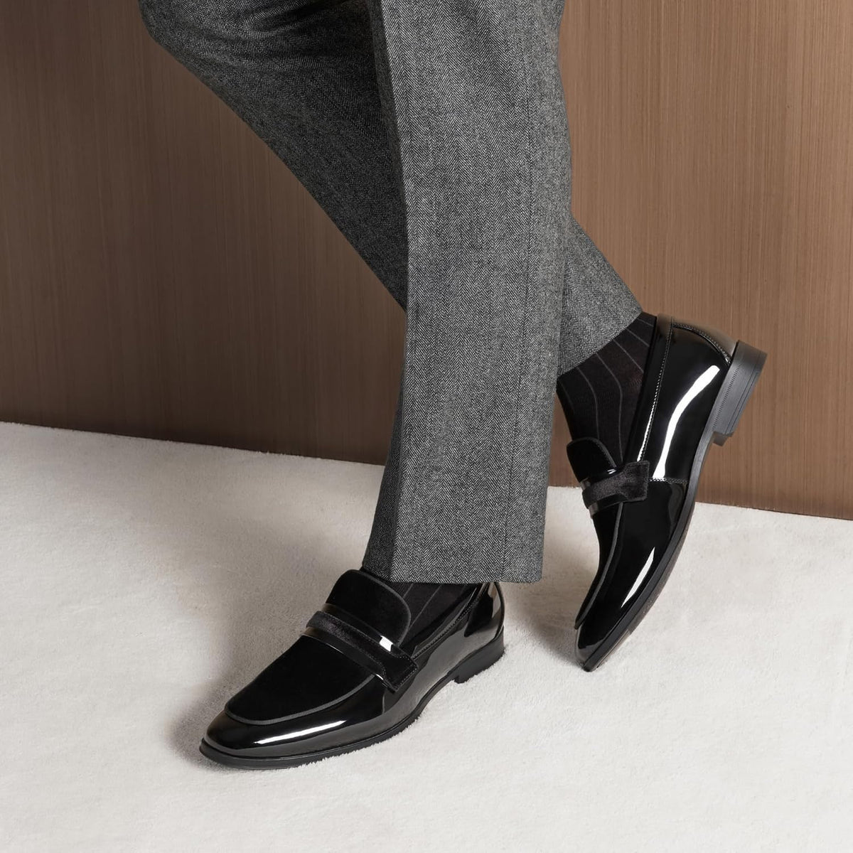 Stylish and comfortable patent leather and velvet loafers from Bruno Marc, with a slip-on design.
