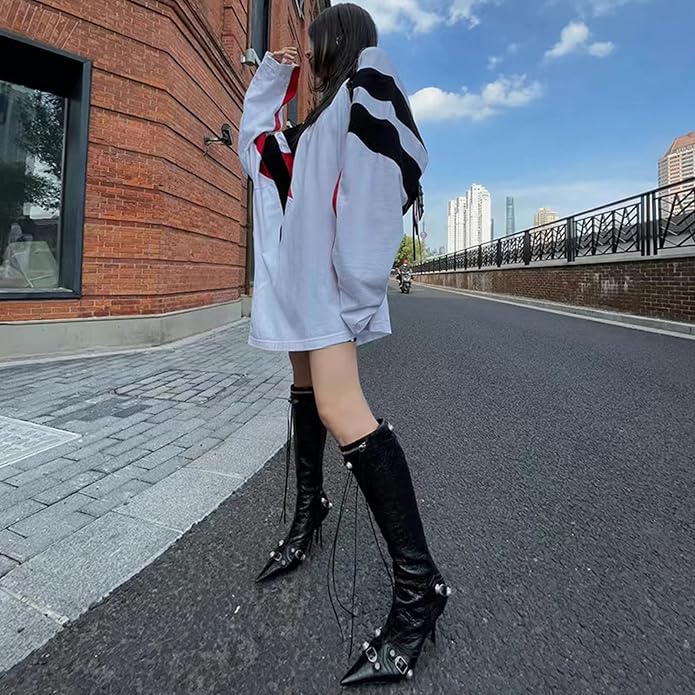 Sleek pointed-toe knee-high boots with stiletto heel, rivets, and tassels - a stylish statement piece. You don't want to miss it! https://a.co/d/0eSH5bug