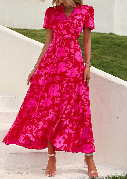 This flowy, floral maxi dress features a flattering wrap design, ruffle hem, and high split - perfect for effortless summer style.
