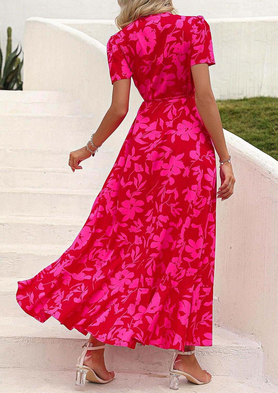 This flowy, floral maxi dress features a flattering wrap design, ruffle hem, and high split - perfect for effortless summer style.