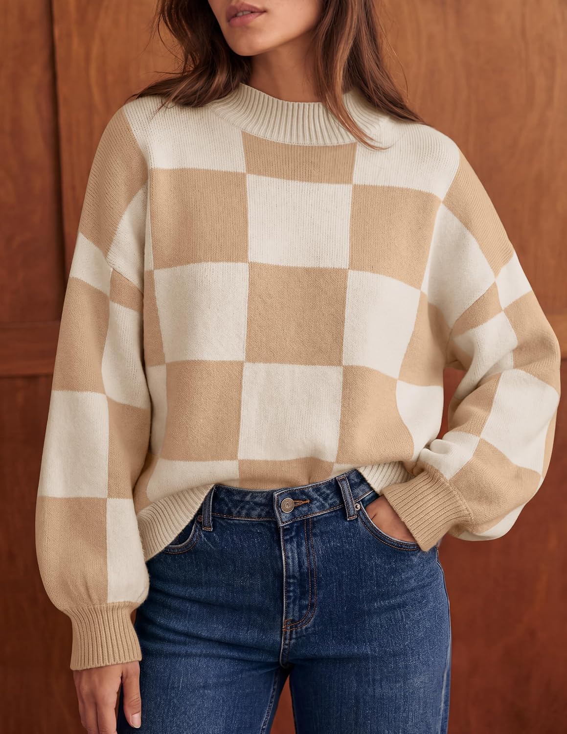 Soft, ribbed knit sweater with chic turtleneck, striped or plaid pattern, and loose, flattering fit for layering. It's a popular product!
