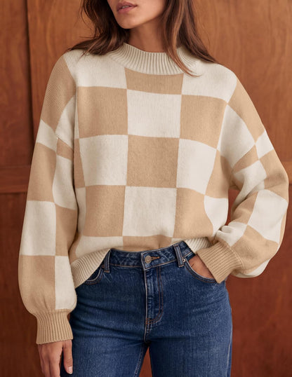 Soft, ribbed knit sweater with chic turtleneck, striped or plaid pattern, and loose, flattering fit for layering. It's a popular product!
