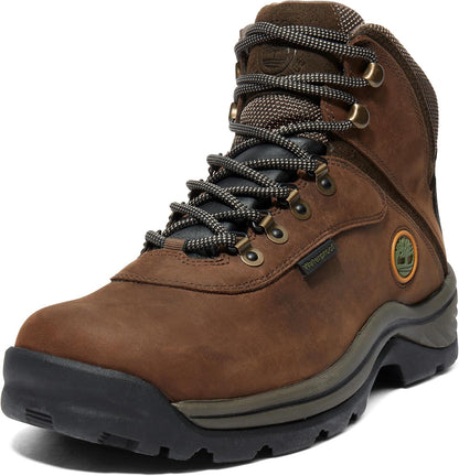 Waterproof leather hiking boots with gusseted tongue, rustproof hardware, and cushioned EVA midsole for all-terrain support and comfort.