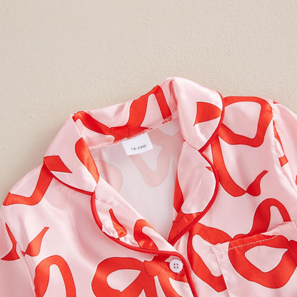 High-quality satin pajama set with Santa Claus and holiday print, soft, breathable fabric, and comfortable fit for cozy winter nights.