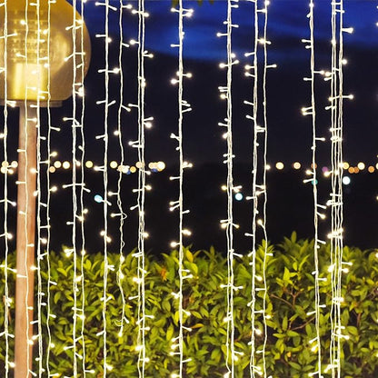 Sterno Home GL43568 Indoor/Outdoor 300 LED Curtain String Light with 8 Light Motion Options, 1-Pack, Warm White with White Cord