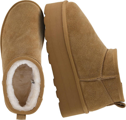 These genuine suede boots feature a cozy faux fur lining and cushioned comfort for all-day wear.