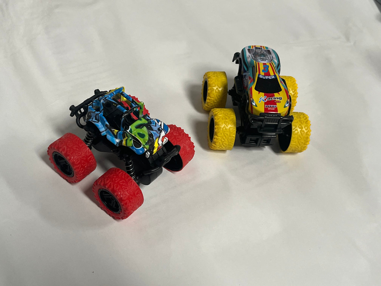 SANMERSEN Monster Truck Toys for Ages 2-4, Friction Cars for Toddlers 1-3 Push and Go 360 Rotating Stunt Car for 2 Year Old Boys Girls Gifts (2 Pack - Red and Yellow)