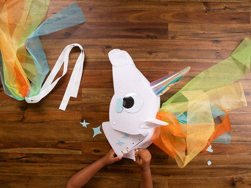 Glowing horn unicorn, A unicorn costume with a light-up horn and a matching tail.